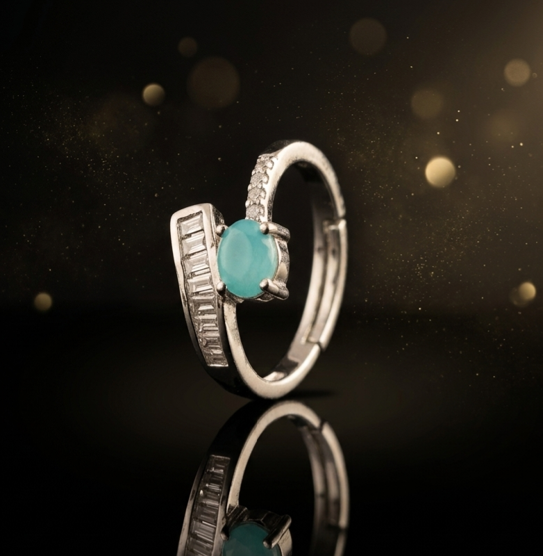 Elegant Aqua Cabochon Ring with Baguette Accent