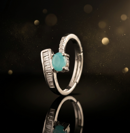 Elegant Aqua Cabochon Ring with Baguette Accent
